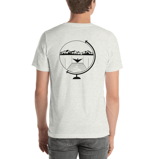 Man in a lightweight gray Globe Unisex T-Shirt by Hummingbird Hammocks with a graphic of a mountain inside a cocktail glass on the back, standing against a green background.