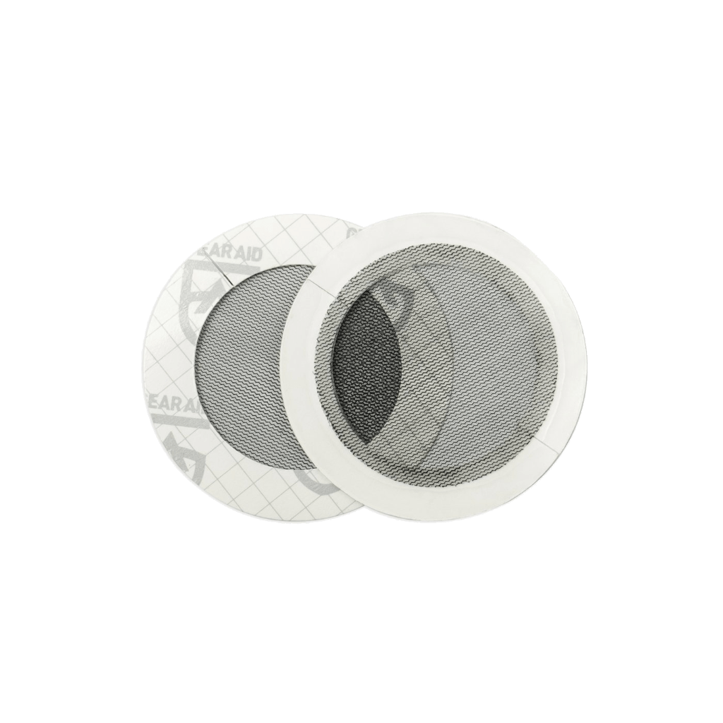 Two round, layered speaker grills on a green background, one shown from the front and the other tilted to show the side with Hummingbird Hammocks' Tenacious Tape Mesh Patches.