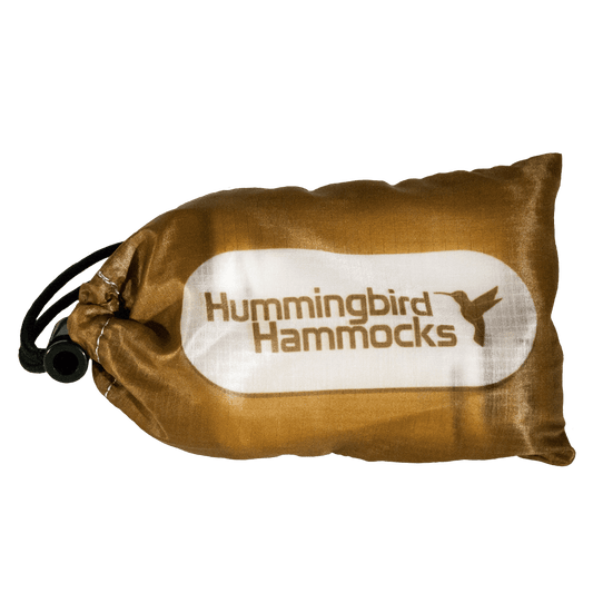 A brown drawstring Hummingbird Hammocks replacement bag with the "Hummingbird Hammocks" logo printed in white.
