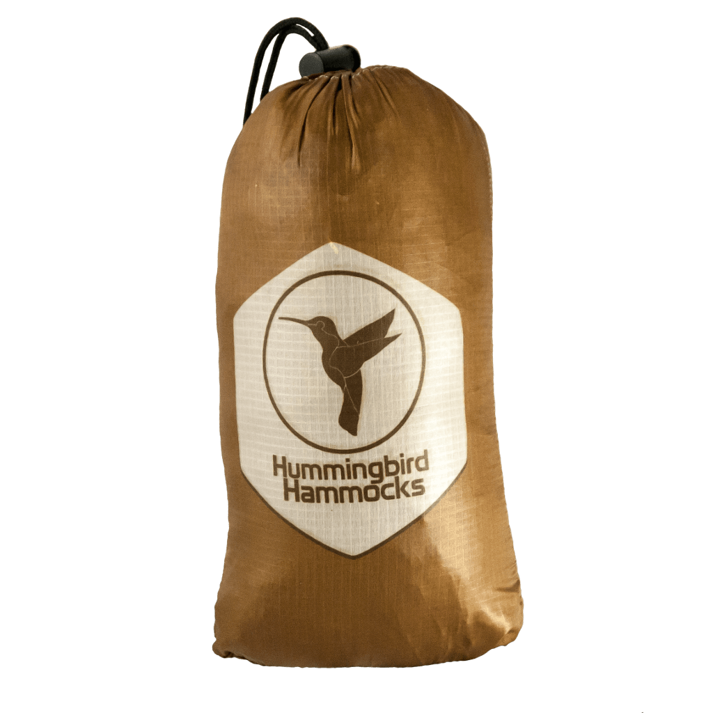 A brown drawstring pouch with the "Hummingbird Hammocks" logo featuring a heron silhouette on a white shield.