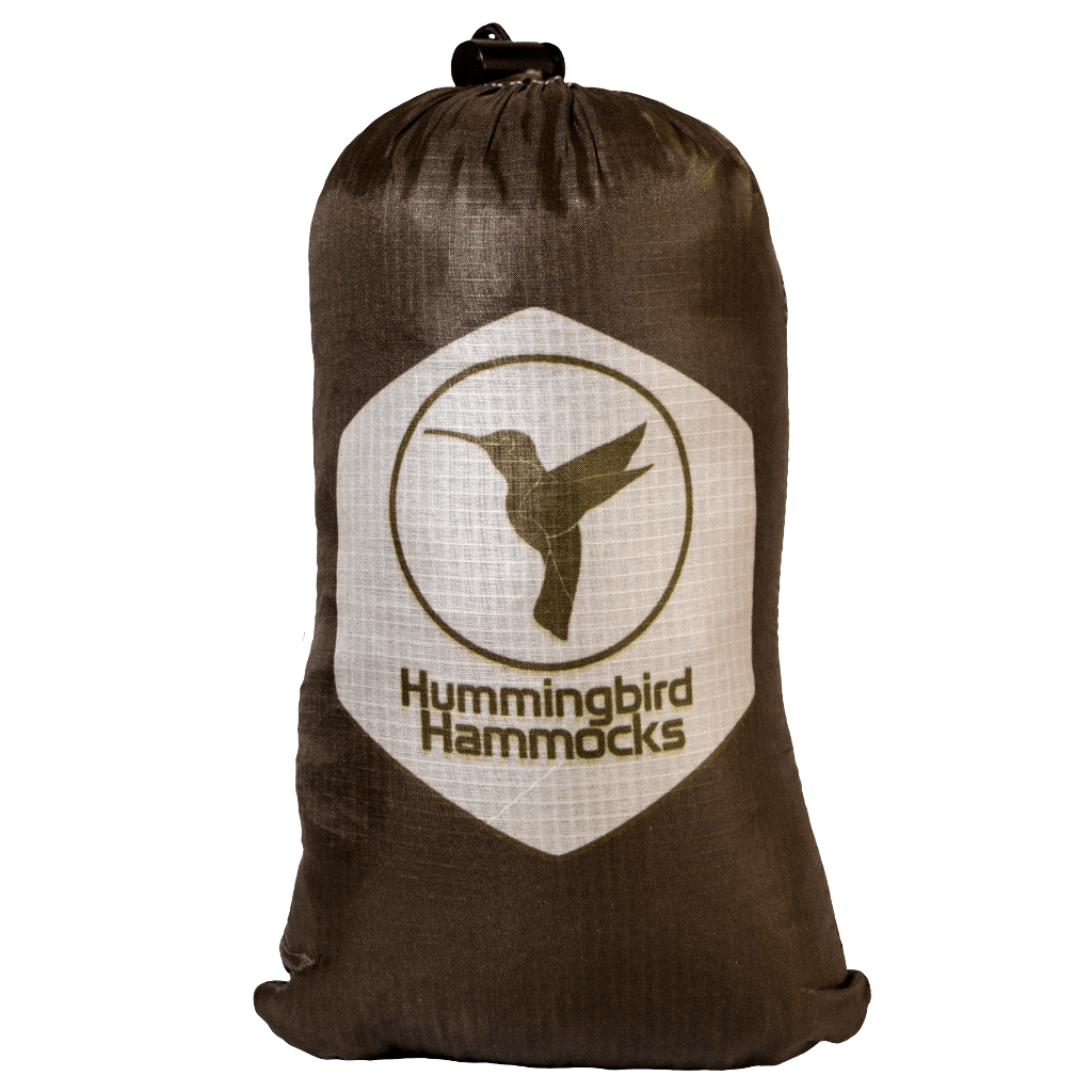A brown drawstring bag made of Silpoly with the "Hummingbird Hammocks" logo featuring a hummingbird silhouette on a beige circle.
