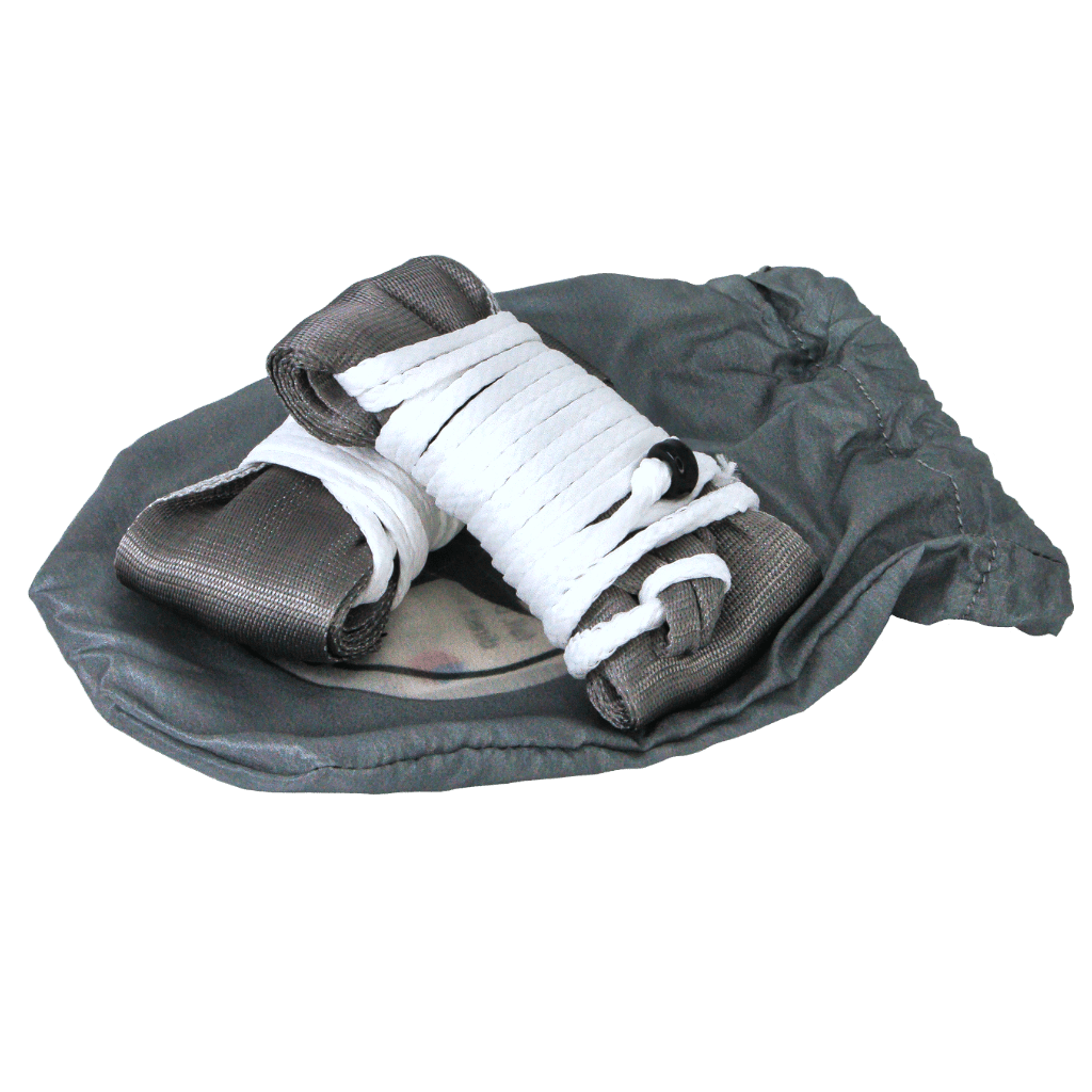 A pair of used hand wraps on a worn-out gym bag, isolated on a green background with Hummingbird Hammocks Tree Straps 2 Inch.