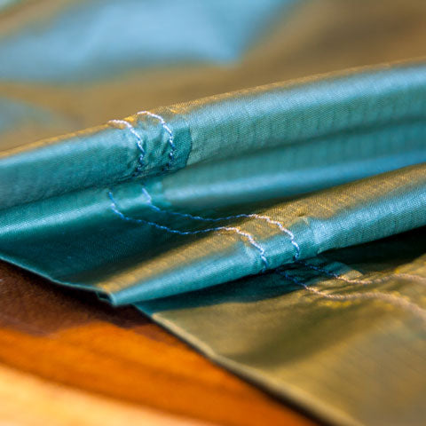 Close up of the stitched end of an ultralight hammock using lock stitching