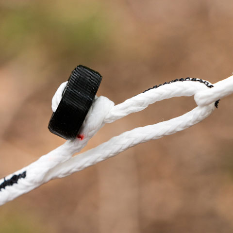 Close up image of a button link attachment system for ultralight hammocks