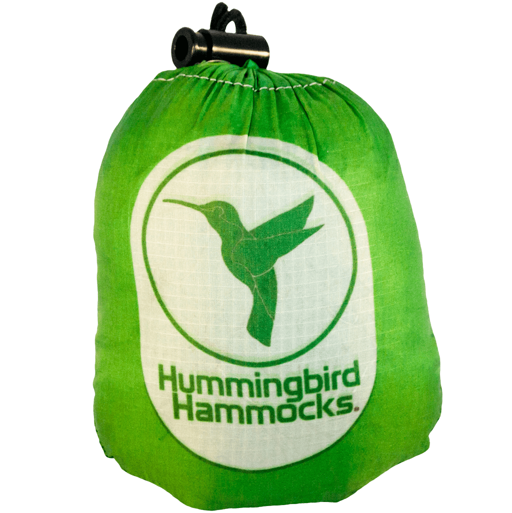 Green drawstring bag with the Hummingbird Hammocks logo featuring a silhouette of a hummingbird and utilizing parachute technology for the Single Hammock.