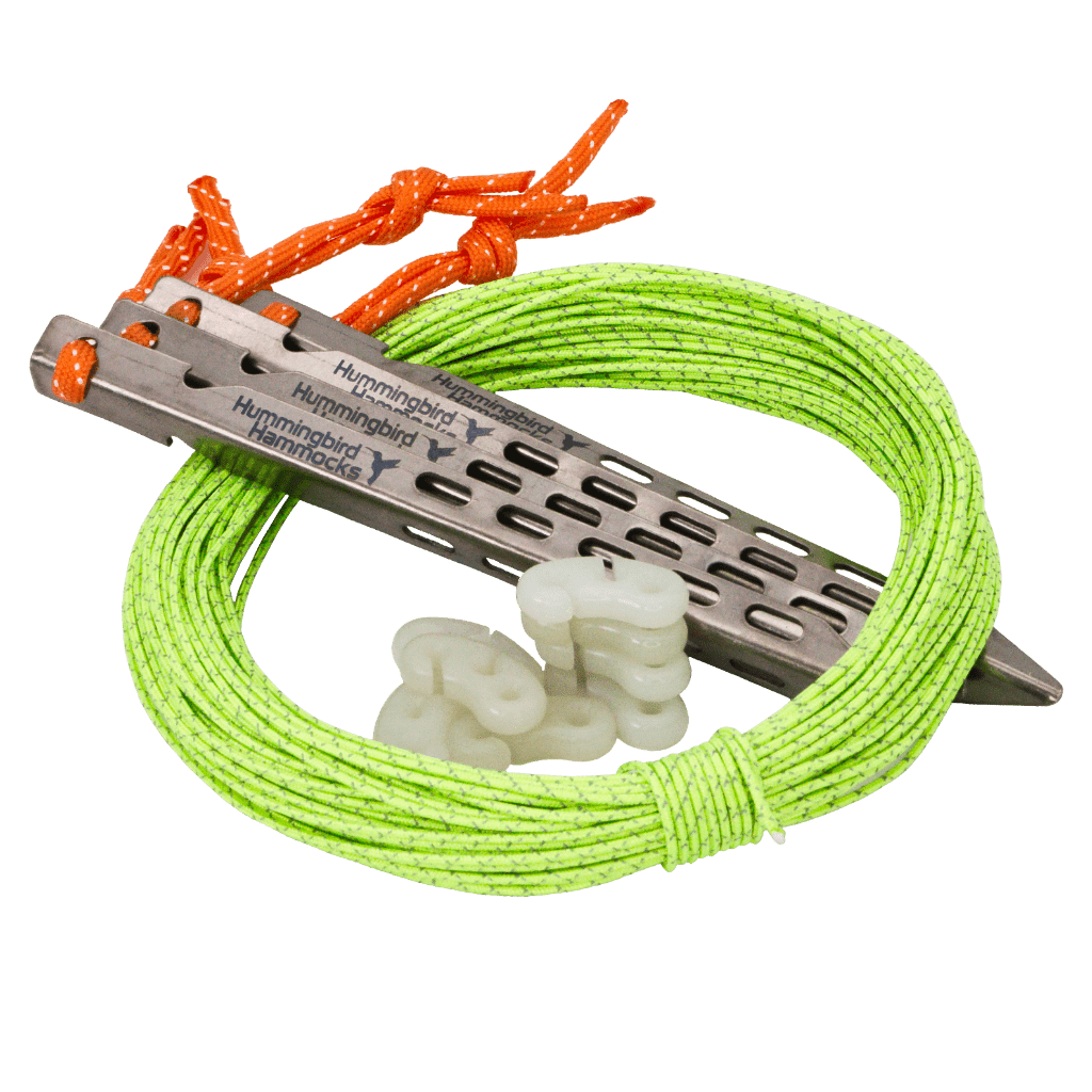 A bright green mountaineering rope coiled around a silver metal belay device with glow-in-the-dark friction adjusters, isolated on a green background, from the Guyline Kit by Hummingbird Hammocks.